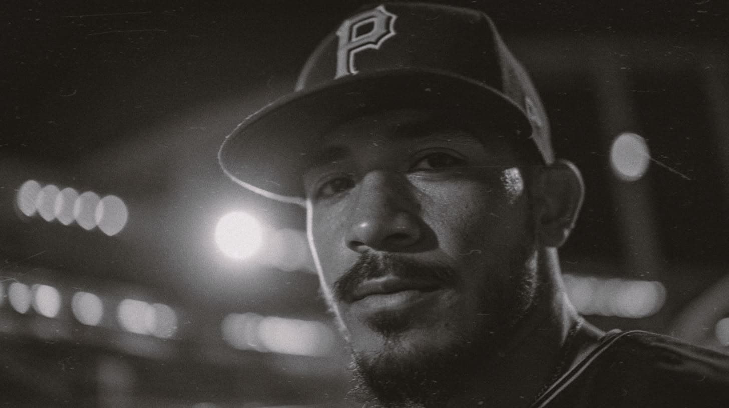 Collector in a Pittsburgh fitted cap at night